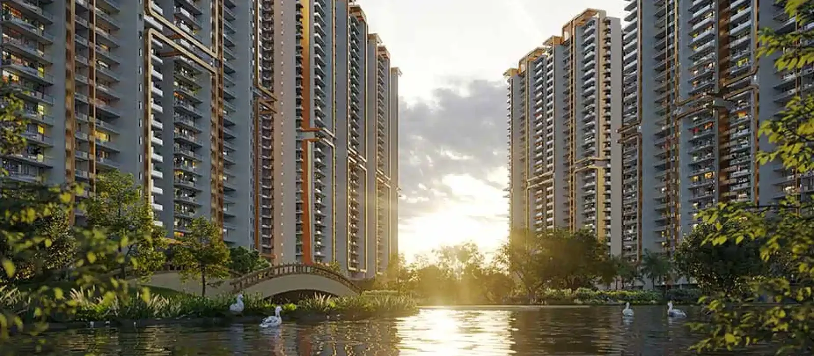 Purva Cityspire towers overlooking waterbody at sunset